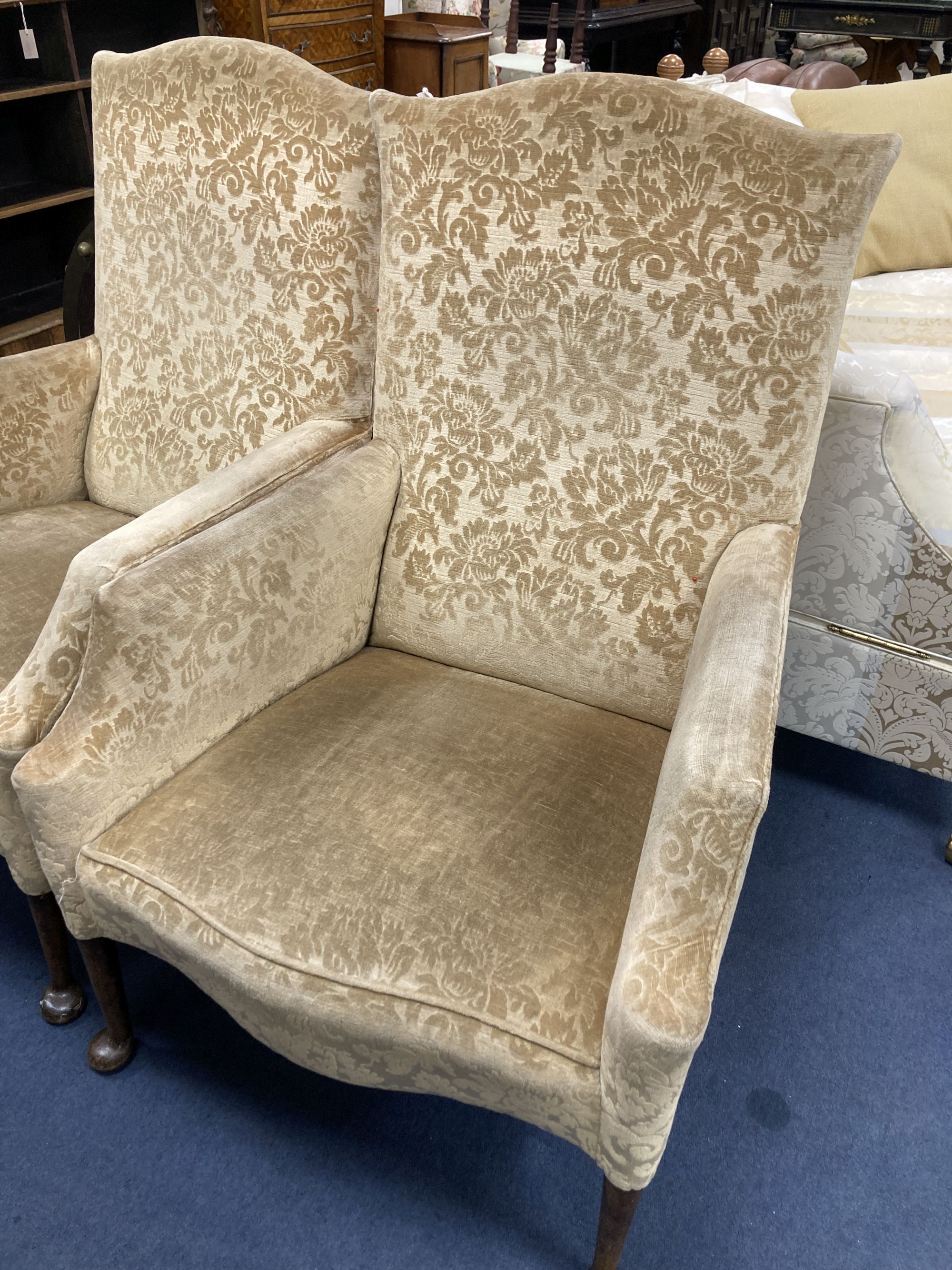 A pair of 1920s upholstered armchairs, width 70cm, depth 70cm, height 102cm